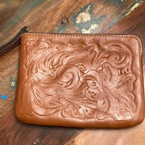 Patricia Nash brown embossed leather wristlet.